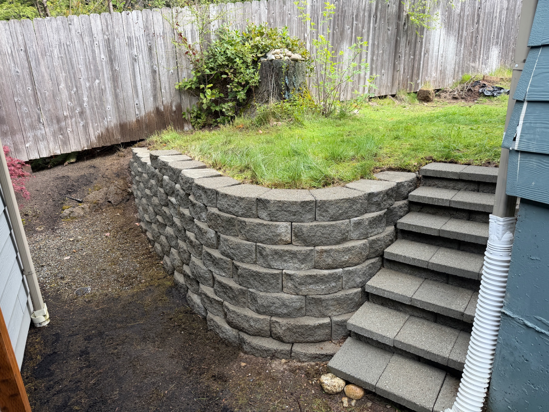 Clean retaining wall after pressure washing